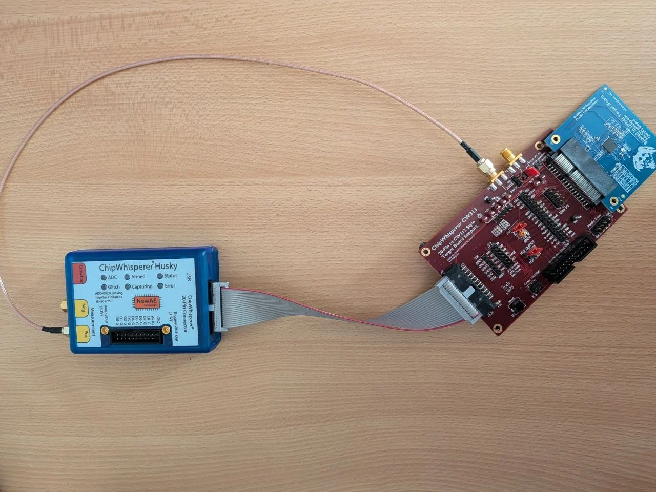 Lab setup: SAM4S on the CW313 baseboard, connected to the ChipWhisperer-Husky via the 20-pin connector